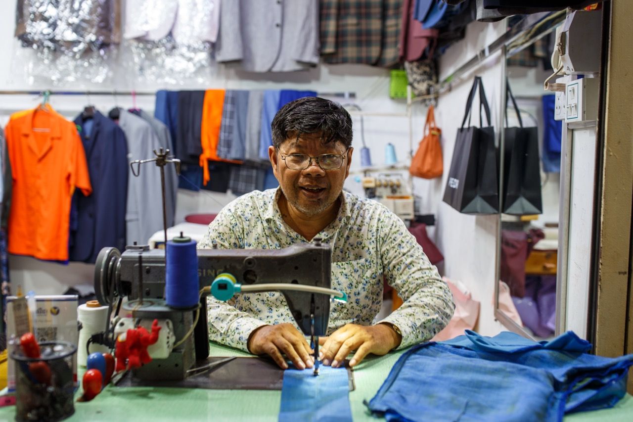 A Man Sewing Fabric