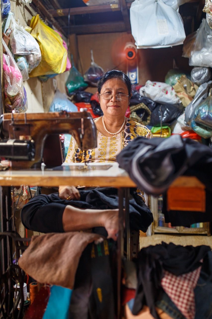 A Woman with Classic Sewing Machine